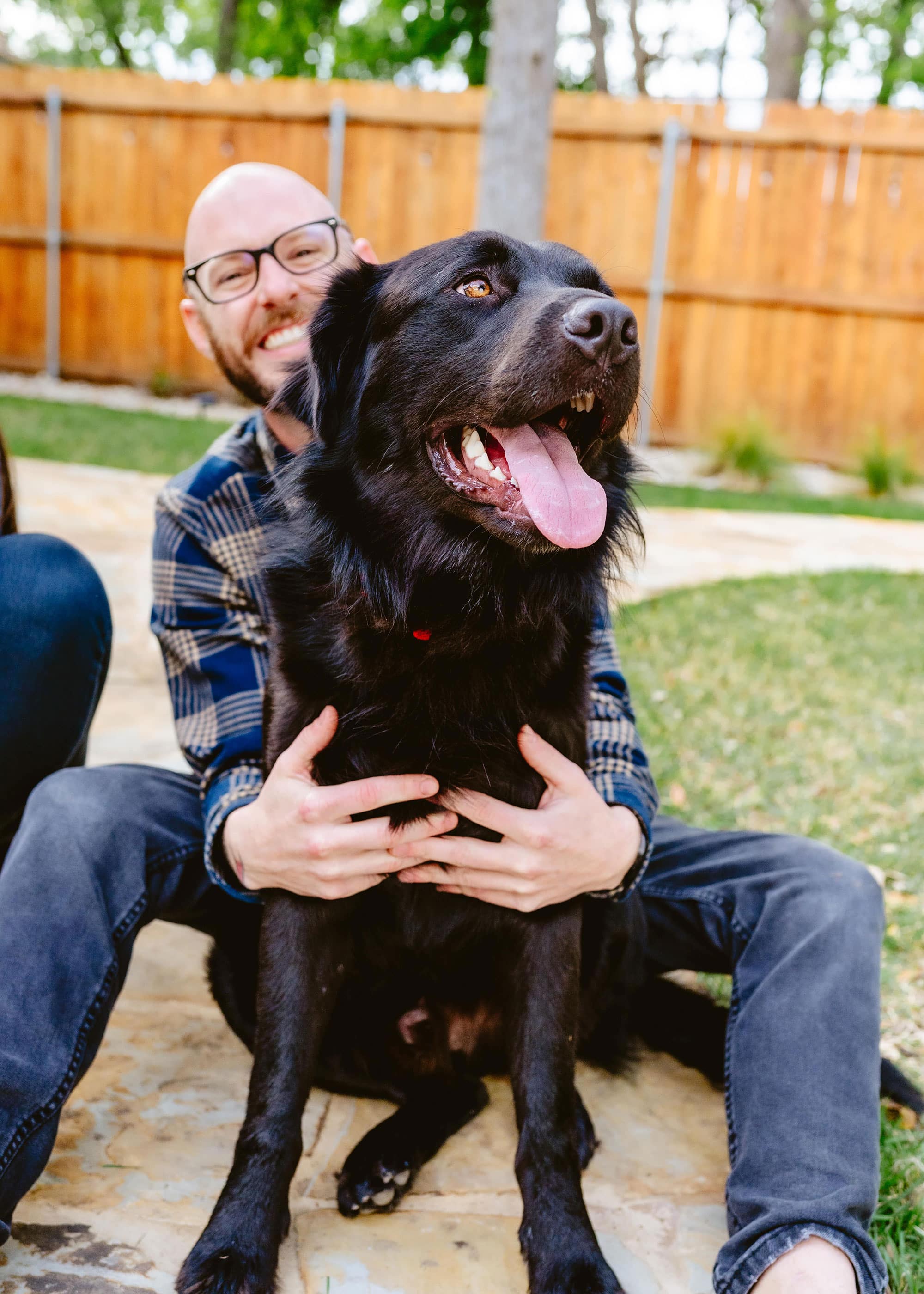 DR. BRIAN HAYES holding a black lab in austin texas