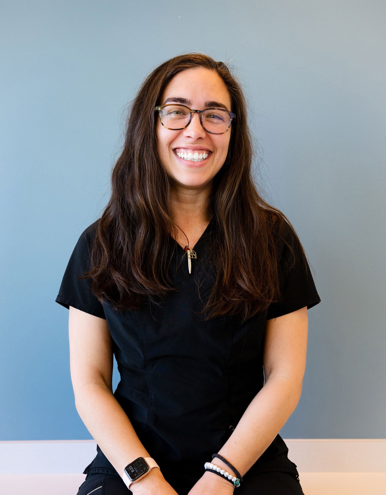 DR. ERICA LOZOYA with a black cat at meow bark